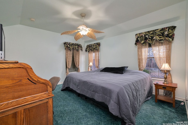 carpeted bedroom featuring ceiling fan and vaulted ceiling