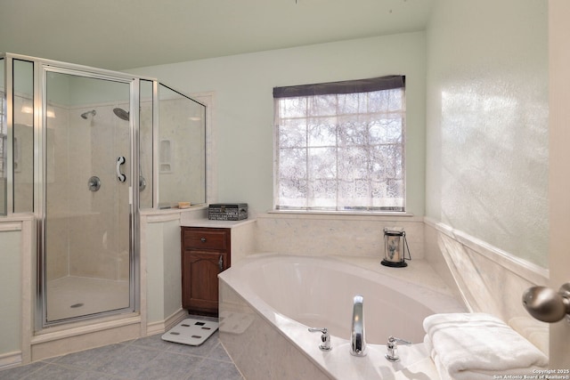 bathroom featuring tile patterned flooring and plus walk in shower