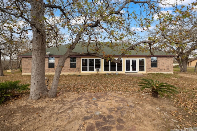 back of property featuring french doors