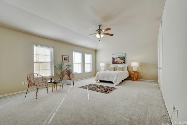 bedroom with ceiling fan, light colored carpet, and lofted ceiling