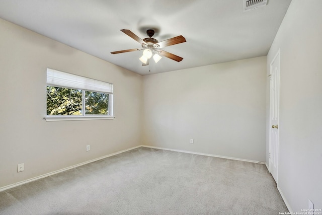 spare room with light carpet and ceiling fan