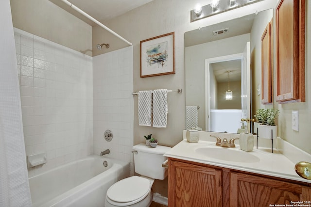 full bathroom featuring vanity, toilet, and shower / tub combo with curtain