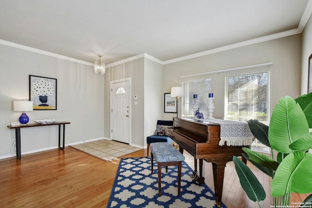 interior space with wood-type flooring, ornamental molding, and a chandelier