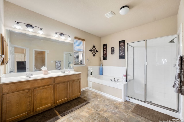 bathroom with plus walk in shower and vanity