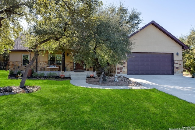 view of front of home featuring covered porch, a garage, and a front lawn