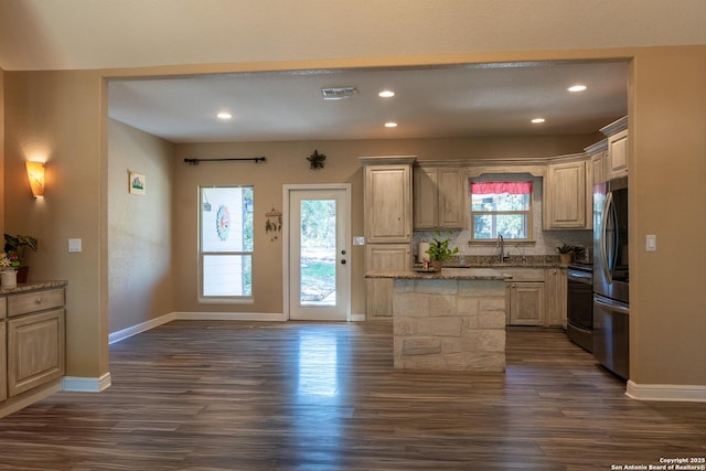 kitchen with decorative backsplash, a center island, electric range, and dark hardwood / wood-style floors