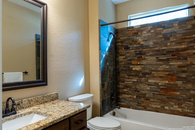 full bathroom featuring bathing tub / shower combination, vanity, and toilet