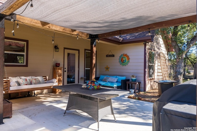 view of patio with outdoor lounge area and grilling area