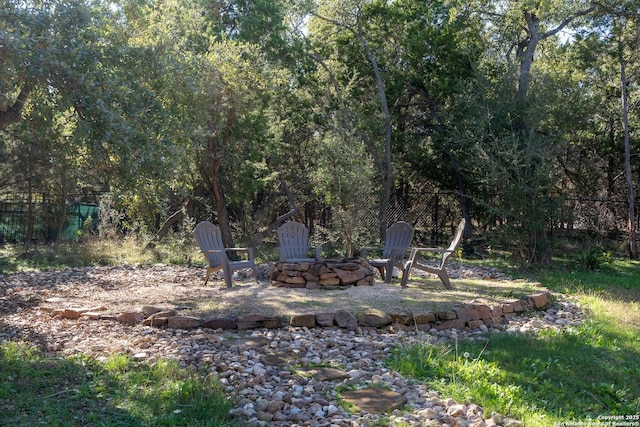 view of yard with an outdoor fire pit