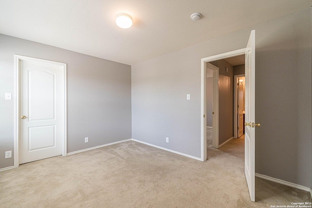 spare room with light colored carpet