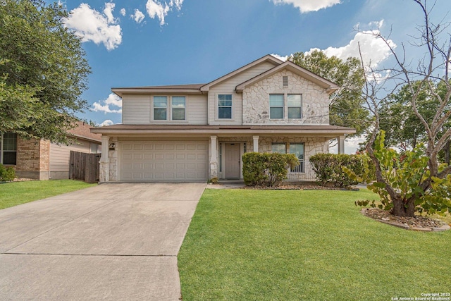 view of property featuring a front lawn and a garage