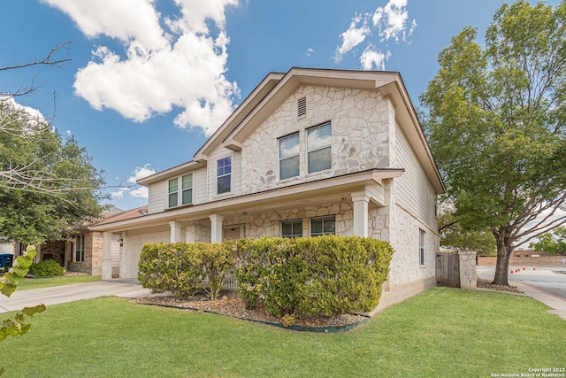 view of front of property with a garage and a front yard