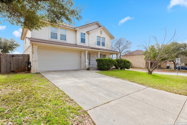 view of front of home with a front lawn and a garage