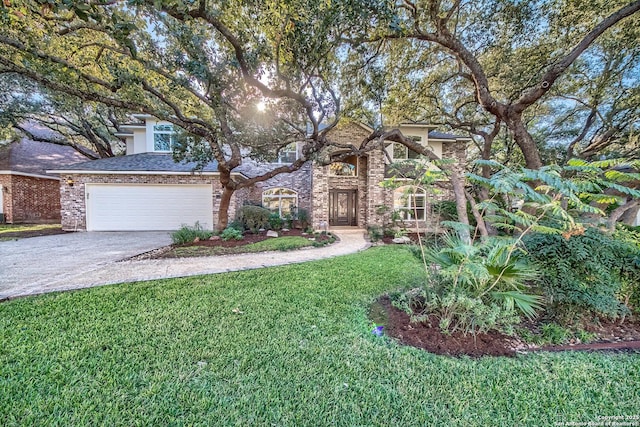 view of front facade featuring a garage and a front lawn