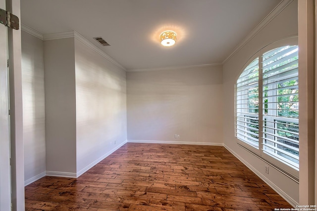 unfurnished room with dark wood-type flooring and ornamental molding