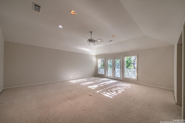 unfurnished room featuring ceiling fan, french doors, light carpet, and lofted ceiling