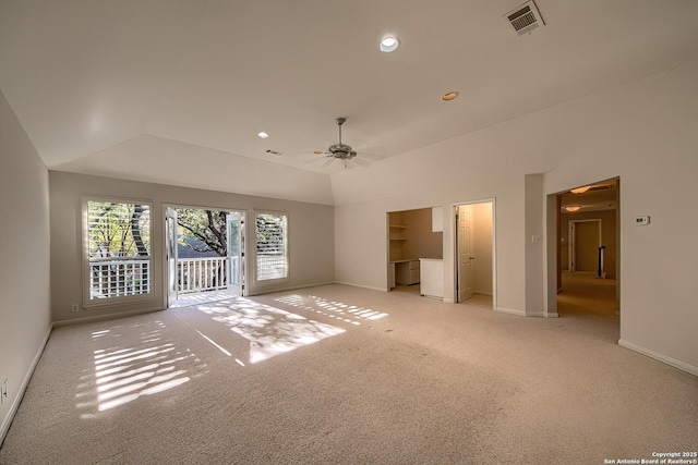 unfurnished bedroom featuring access to outside, light colored carpet, ceiling fan, a closet, and lofted ceiling