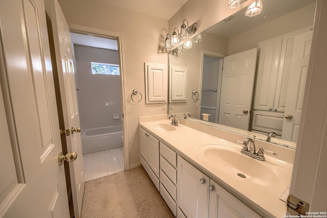 bathroom with tile patterned floors and vanity