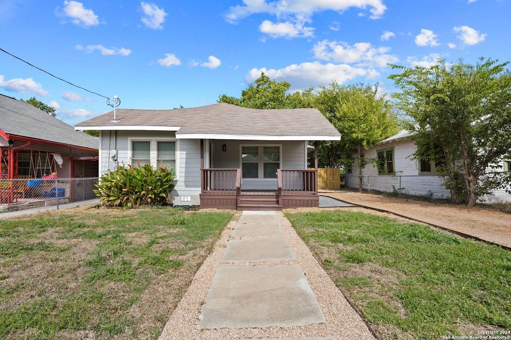 view of front of house with a front lawn and a porch