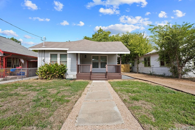 view of front of house with a front lawn and a porch