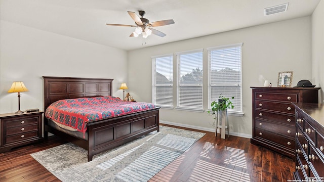 bedroom with ceiling fan and dark hardwood / wood-style floors