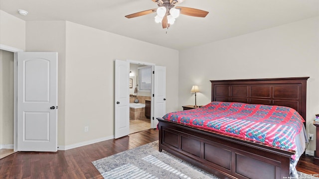 bedroom featuring hardwood / wood-style flooring, ceiling fan, and ensuite bath