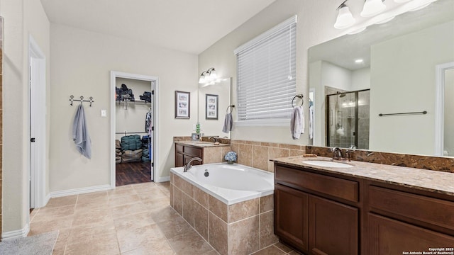 bathroom with vanity, tile patterned floors, and independent shower and bath