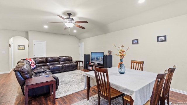 dining space featuring dark hardwood / wood-style flooring, ceiling fan, and lofted ceiling