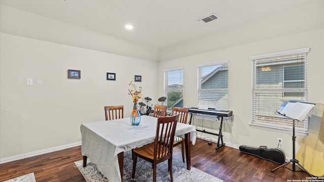 dining room with dark wood-type flooring