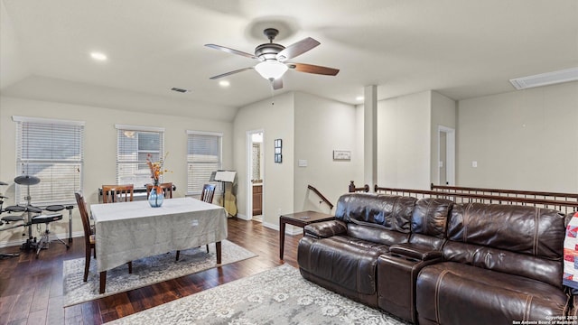 living room with ceiling fan and dark hardwood / wood-style floors