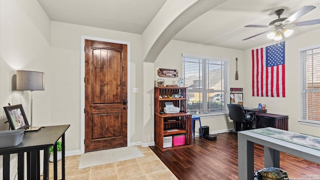 foyer with tile patterned flooring and ceiling fan