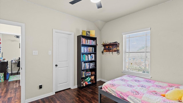 bedroom featuring ceiling fan and dark wood-type flooring