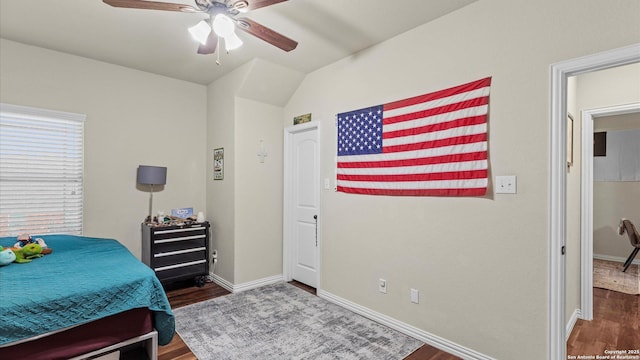 bedroom featuring ceiling fan and dark wood-type flooring