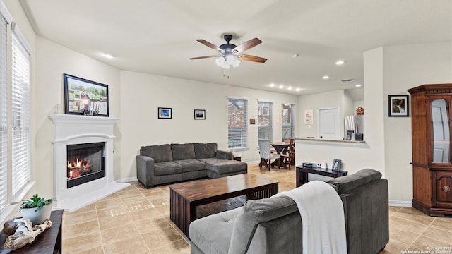 tiled living room with ceiling fan