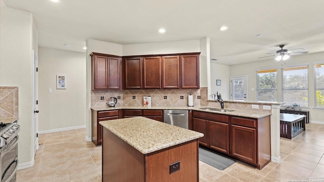 kitchen featuring a center island, sink, kitchen peninsula, and stainless steel appliances