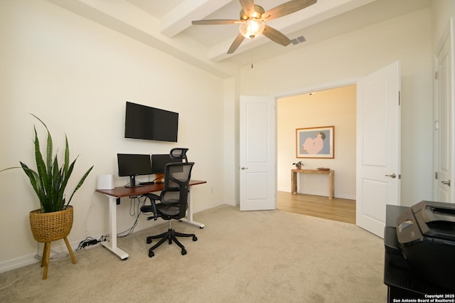 office area with light carpet, beamed ceiling, and ceiling fan