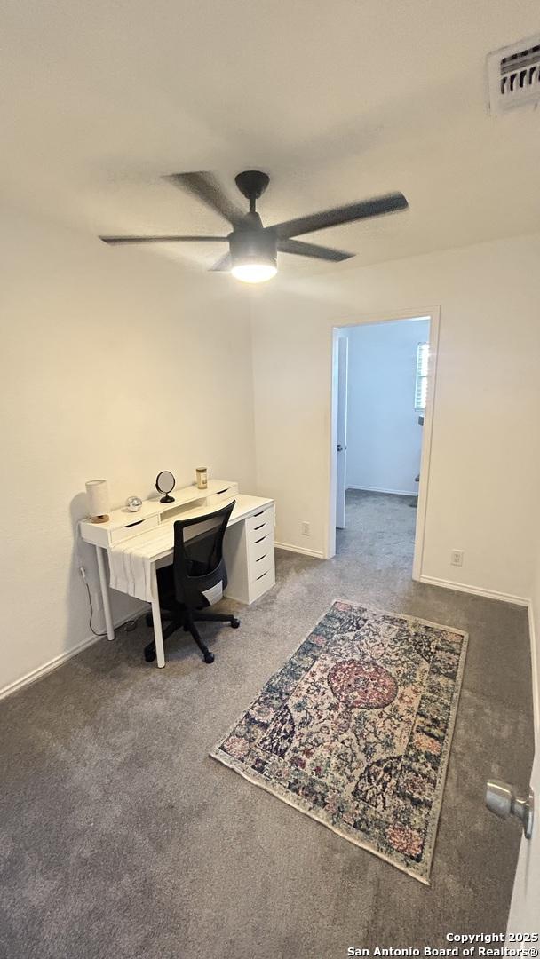 office with carpet and ceiling fan