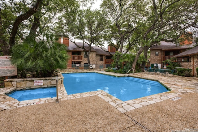 pool featuring a patio area