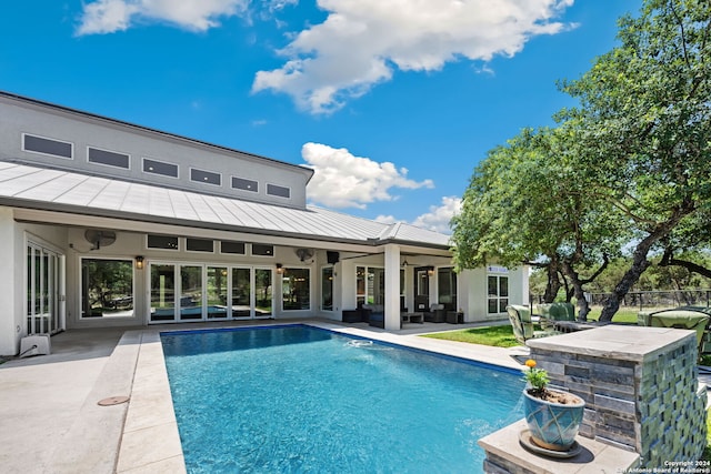 view of pool with a patio area and an outdoor living space