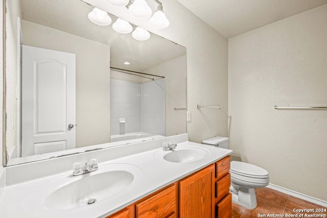 full bathroom with tile patterned floors, vanity, toilet, and tub / shower combination