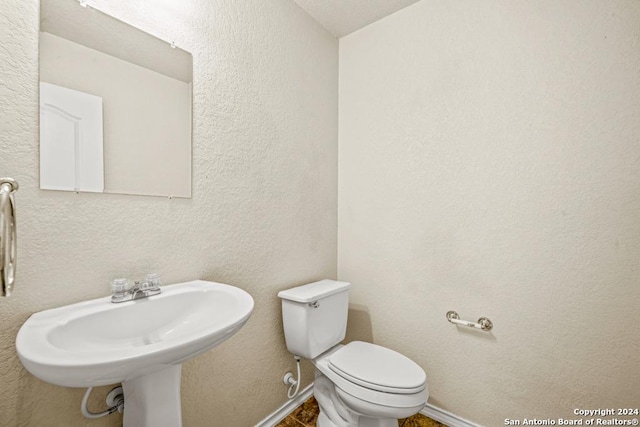 bathroom with toilet and sink