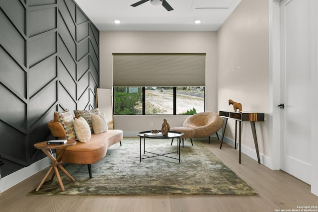 living area featuring ceiling fan and light wood-type flooring