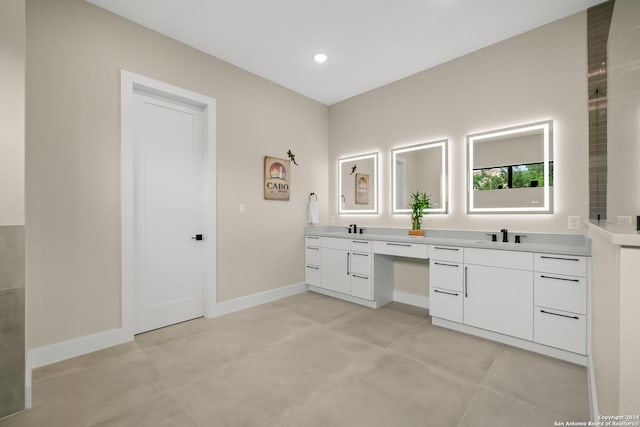 bathroom featuring vanity and concrete floors