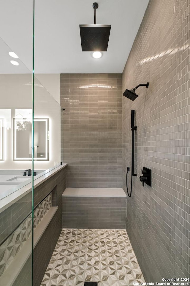 bathroom with a tile shower