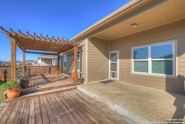 wooden deck featuring a pergola