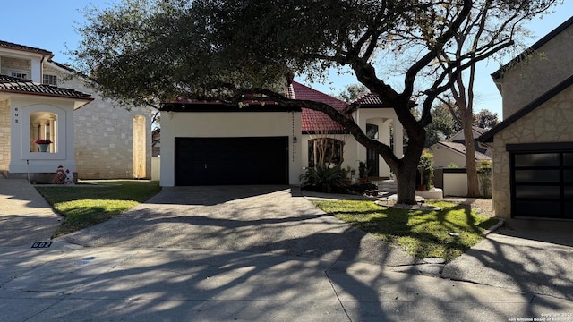 mediterranean / spanish-style home with a garage