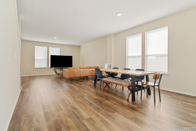 dining space with light hardwood / wood-style flooring