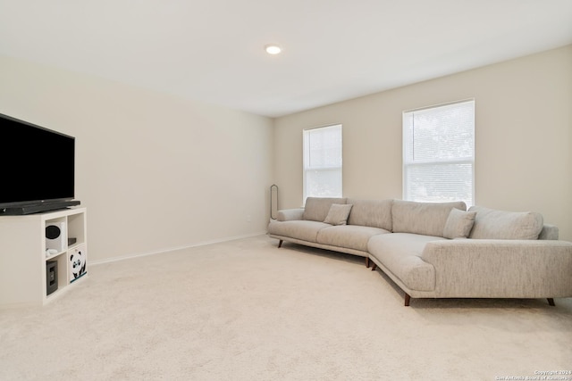 living room featuring light carpet