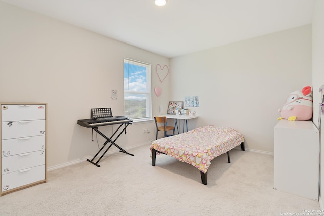 interior space with washer / clothes dryer and light colored carpet