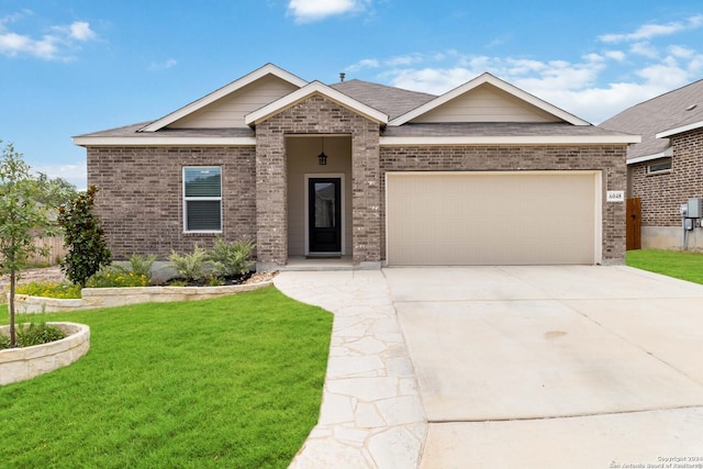 view of front of home with a garage and a front yard